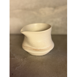 M�lkekande drejet i h�nden 