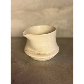 M�lkekande drejet i h�nden 